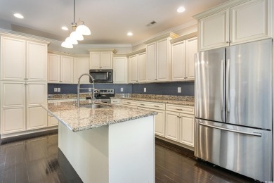 Step into luxury and comfort with this stunning executive-style on Wild Wing Plantation in South Carolina - for sale on GolfHomes.com, golf home, golf lot