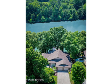 This lovely lakefront home located in a quiet cove, is nestled on Toqua Golf Course - Loudon County in Tennessee - for sale on GolfHomes.com, golf home, golf lot