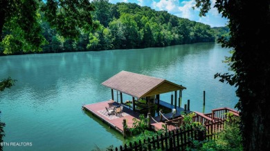 This lovely lakefront home located in a quiet cove, is nestled on Toqua Golf Course - Loudon County in Tennessee - for sale on GolfHomes.com, golf home, golf lot