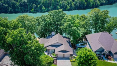This lovely lakefront home located in a quiet cove, is nestled on Toqua Golf Course - Loudon County in Tennessee - for sale on GolfHomes.com, golf home, golf lot