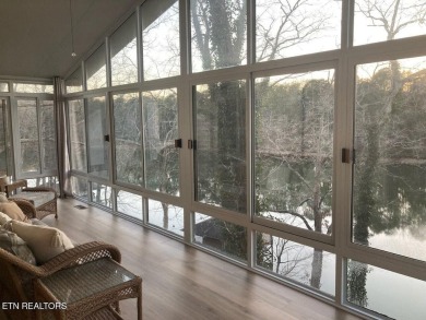 This lovely lakefront home located in a quiet cove, is nestled on Toqua Golf Course - Loudon County in Tennessee - for sale on GolfHomes.com, golf home, golf lot