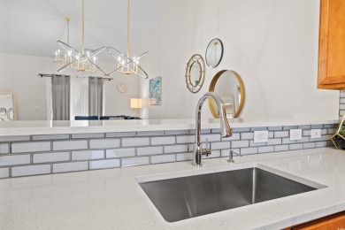 Modern and fully furnished 2 bed, 2 bath top-floor unit in on Barefoot Resort and Golf Club  in South Carolina - for sale on GolfHomes.com, golf home, golf lot