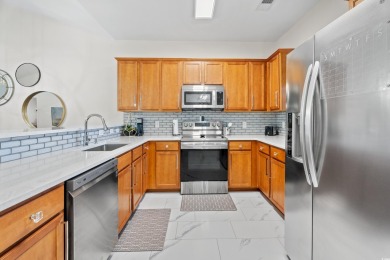 Modern and fully furnished 2 bed, 2 bath top-floor unit in on Barefoot Resort and Golf Club  in South Carolina - for sale on GolfHomes.com, golf home, golf lot
