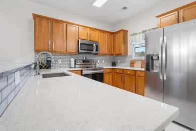 Modern and fully furnished 2 bed, 2 bath top-floor unit in on Barefoot Resort and Golf Club  in South Carolina - for sale on GolfHomes.com, golf home, golf lot