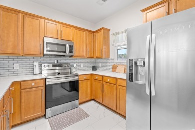 Modern and fully furnished 2 bed, 2 bath top-floor unit in on Barefoot Resort and Golf Club  in South Carolina - for sale on GolfHomes.com, golf home, golf lot