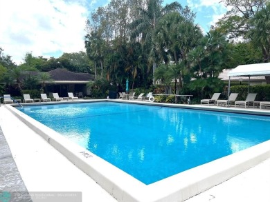 NESTLED IN ONE OF PALM AIRE COUNTRY CLUB'S MOST DESIRABLE on Palm-Aire Country Club and Resort - The Oaks in Florida - for sale on GolfHomes.com, golf home, golf lot
