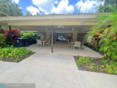 NESTLED IN ONE OF PALM AIRE COUNTRY CLUB'S MOST DESIRABLE on Palm-Aire Country Club and Resort - The Oaks in Florida - for sale on GolfHomes.com, golf home, golf lot
