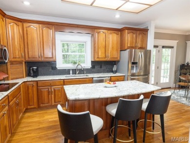 Stunning two-story brick home nestled on 6.3 acres in Hannibal on Hannibal Country Club in Missouri - for sale on GolfHomes.com, golf home, golf lot