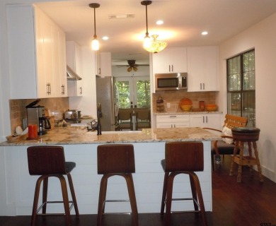 Elegance meets country charm in this completely remodeled home on Holly Lake Ranch Golf Club in Texas - for sale on GolfHomes.com, golf home, golf lot