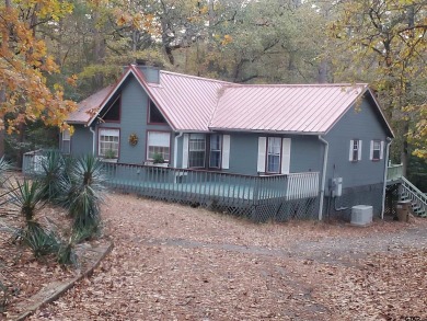 Beautiful chalet style home with Personality plus nestled on two on Holly Lake Ranch Golf Club in Texas - for sale on GolfHomes.com, golf home, golf lot