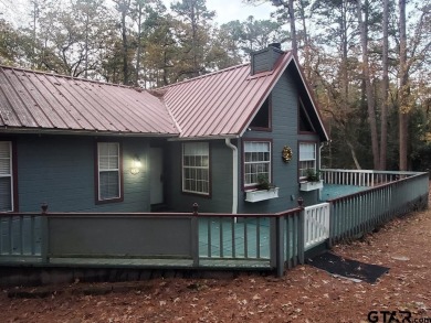 Beautiful chalet style home with Personality plus nestled on two on Holly Lake Ranch Golf Club in Texas - for sale on GolfHomes.com, golf home, golf lot
