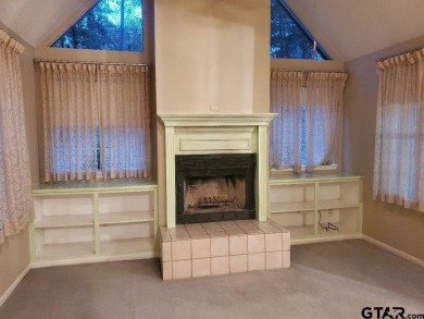 Beautiful chalet style home with Personality plus nestled on two on Holly Lake Ranch Golf Club in Texas - for sale on GolfHomes.com, golf home, golf lot
