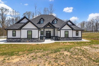 Nestled within the verdant embrace of Tennessee's picturesque on Sweetens Cove Golf Club in Tennessee - for sale on GolfHomes.com, golf home, golf lot