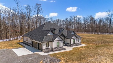 Nestled within the verdant embrace of Tennessee's picturesque on Sweetens Cove Golf Club in Tennessee - for sale on GolfHomes.com, golf home, golf lot