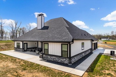 Nestled within the verdant embrace of Tennessee's picturesque on Sweetens Cove Golf Club in Tennessee - for sale on GolfHomes.com, golf home, golf lot