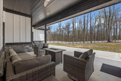 Nestled within the verdant embrace of Tennessee's picturesque on Sweetens Cove Golf Club in Tennessee - for sale on GolfHomes.com, golf home, golf lot