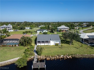 This waterfront home places the Peace River right in your on Deep Creek Golf Club in Florida - for sale on GolfHomes.com, golf home, golf lot