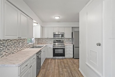 Under contract-accepting backup offers. Welcome to your dream on Oak Hills Country Club in Florida - for sale on GolfHomes.com, golf home, golf lot