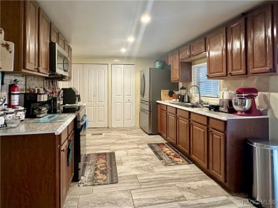Welcome to this beautifully maintained 2-bedroom, 2-bathroom on Heather Golf and Country Club in Florida - for sale on GolfHomes.com, golf home, golf lot