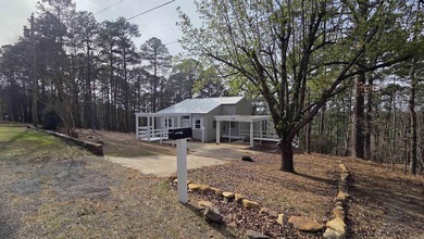 Located in the heart of Fairfield Bay, this well-maintained home on Indian Hills Country Club in Arkansas - for sale on GolfHomes.com, golf home, golf lot