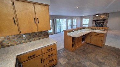 Located in the heart of Fairfield Bay, this well-maintained home on Indian Hills Country Club in Arkansas - for sale on GolfHomes.com, golf home, golf lot