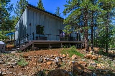 Perched on a serene hillside in Munds Park and bordered by on Pinewood Country Club in Arizona - for sale on GolfHomes.com, golf home, golf lot