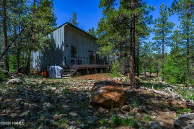 Perched on a serene hillside in Munds Park and bordered by on Pinewood Country Club in Arizona - for sale on GolfHomes.com, golf home, golf lot