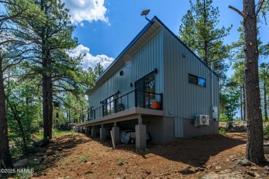Perched on a serene hillside in Munds Park and bordered by on Pinewood Country Club in Arizona - for sale on GolfHomes.com, golf home, golf lot