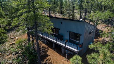 Perched on a serene hillside in Munds Park and bordered by on Pinewood Country Club in Arizona - for sale on GolfHomes.com, golf home, golf lot