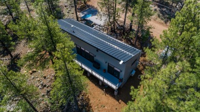 Perched on a serene hillside in Munds Park and bordered by on Pinewood Country Club in Arizona - for sale on GolfHomes.com, golf home, golf lot
