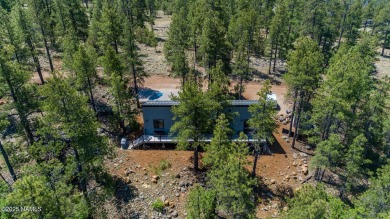 Perched on a serene hillside in Munds Park and bordered by on Pinewood Country Club in Arizona - for sale on GolfHomes.com, golf home, golf lot