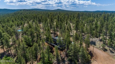 Perched on a serene hillside in Munds Park and bordered by on Pinewood Country Club in Arizona - for sale on GolfHomes.com, golf home, golf lot