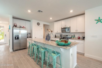 Stunning 4 bedroom, 2 bath lakefront home is nestled in the on LPGA International Golf Course in Florida - for sale on GolfHomes.com, golf home, golf lot