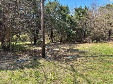 This buildable lot is located in the highly sought-after on De Cordova Bend Country Club in Texas - for sale on GolfHomes.com, golf home, golf lot