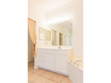 Beautifully refreshed and move-in ready, this elegant 3-bedroom on The Colony Golf and Country Club in Florida - for sale on GolfHomes.com, golf home, golf lot