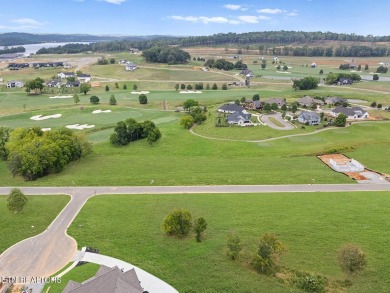 This half acre lot offers views of TN Nationals 13th and 14th on Tennessee National Golf Club in Tennessee - for sale on GolfHomes.com, golf home, golf lot