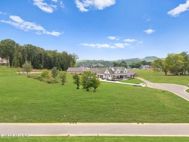 This half acre lot offers views of TN Nationals 13th and 14th on Tennessee National Golf Club in Tennessee - for sale on GolfHomes.com, golf home, golf lot