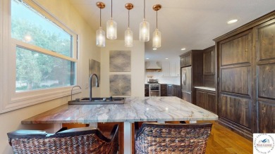 This expansive two-story residence, located in the desirable on Sedalia Country Club in Missouri - for sale on GolfHomes.com, golf home, golf lot