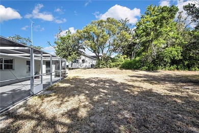 Welcome to this light and bright 3-bedroom, 2-bath home situated on Sugarmill Woods Golf and Country Club in Florida - for sale on GolfHomes.com, golf home, golf lot