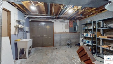 This expansive two-story residence, located in the desirable on Sedalia Country Club in Missouri - for sale on GolfHomes.com, golf home, golf lot