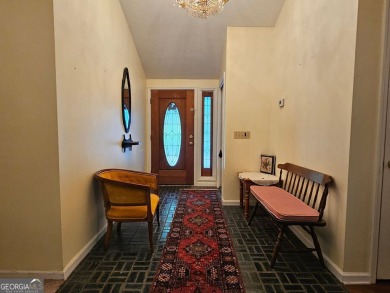 This 3 bed, 2 bath single-story home sits on the smaller fishing on Fairfield Plantation Golf and Country Club in Georgia - for sale on GolfHomes.com, golf home, golf lot