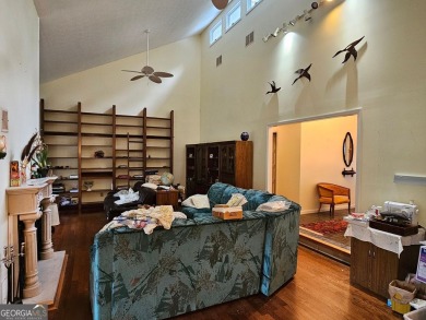 This 3 bed, 2 bath single-story home sits on the smaller fishing on Fairfield Plantation Golf and Country Club in Georgia - for sale on GolfHomes.com, golf home, golf lot