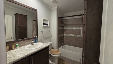 Nestled in the sought-after, gated 55+ community of Riverside on The Riverside Golf Club in Florida - for sale on GolfHomes.com, golf home, golf lot