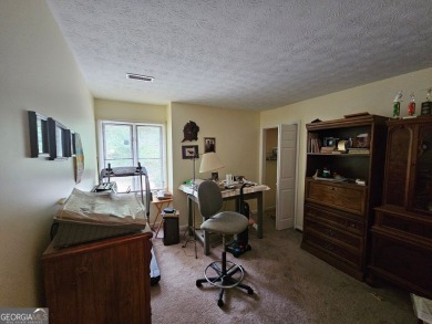 This 3 bed, 2 bath single-story home sits on the smaller fishing on Fairfield Plantation Golf and Country Club in Georgia - for sale on GolfHomes.com, golf home, golf lot