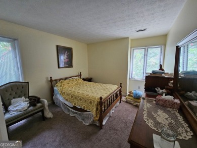 This 3 bed, 2 bath single-story home sits on the smaller fishing on Fairfield Plantation Golf and Country Club in Georgia - for sale on GolfHomes.com, golf home, golf lot