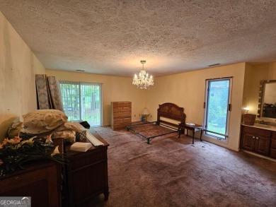 This 3 bed, 2 bath single-story home sits on the smaller fishing on Fairfield Plantation Golf and Country Club in Georgia - for sale on GolfHomes.com, golf home, golf lot