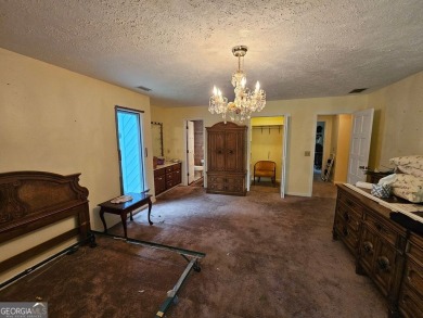This 3 bed, 2 bath single-story home sits on the smaller fishing on Fairfield Plantation Golf and Country Club in Georgia - for sale on GolfHomes.com, golf home, golf lot