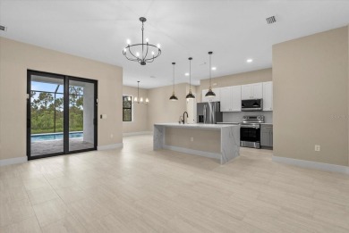 Welcome to your Florida dream home! This gorgeous newly built on Sabal Trace Golf and Country Club in Florida - for sale on GolfHomes.com, golf home, golf lot