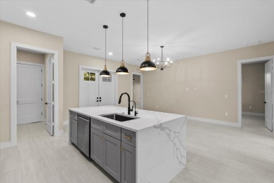 Welcome to your Florida dream home! This gorgeous newly built on Sabal Trace Golf and Country Club in Florida - for sale on GolfHomes.com, golf home, golf lot