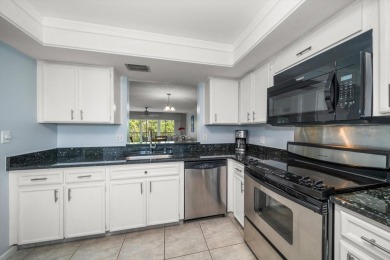 Enjoy Effortless Condo Living with Golf Course Views! Welcome to on East Bay Golf Club in Florida - for sale on GolfHomes.com, golf home, golf lot